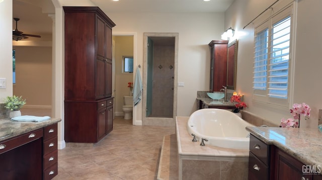 3006 Springbank Ct, Bakersfield, CA 93311 - bathroom featuring a bath, ceiling fan, a stall shower, toilet, and vanity