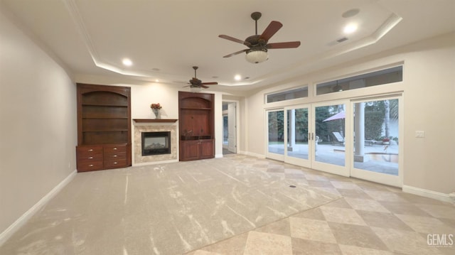 3006 Springbank Ct, Bakersfield, CA 93311 - unfurnished living room with a raised ceiling, a glass covered fireplace, recessed lighting, baseboards, and ceiling fan