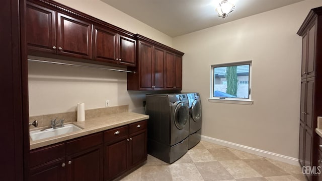 3006 Springbank Ct, Bakersfield, CA 93311 - laundry room featuring cabinet space, washing machine and clothes dryer, and baseboards