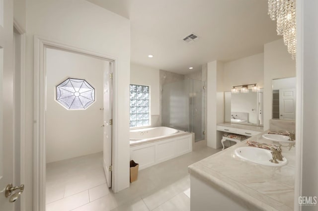 bathroom featuring vanity, tile patterned floors, and plus walk in shower