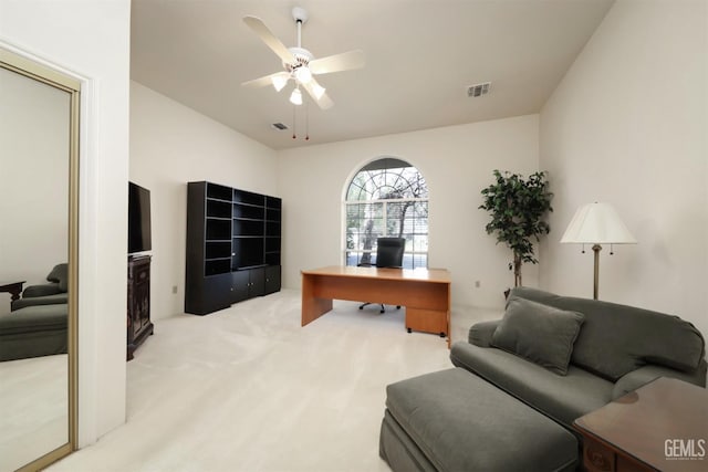 office area featuring ceiling fan and light carpet