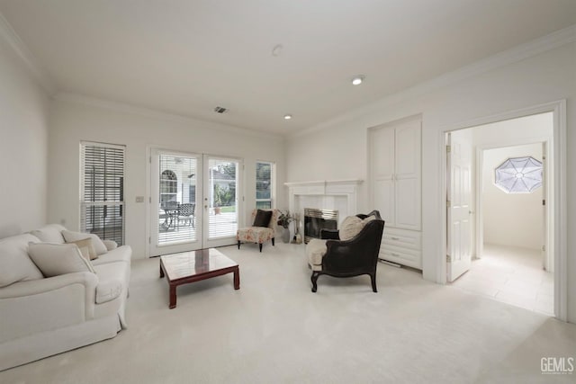 living room with ornamental molding and light colored carpet