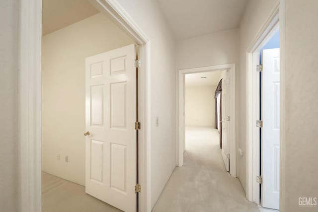 corridor with light colored carpet