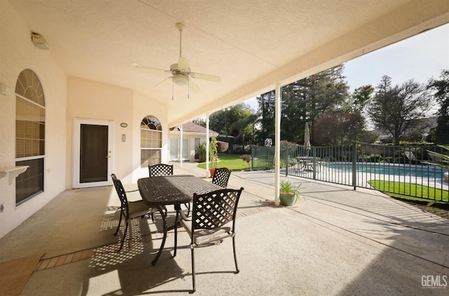 view of patio / terrace with a fenced in pool