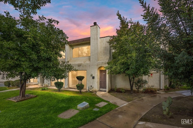 view of front of home with a lawn