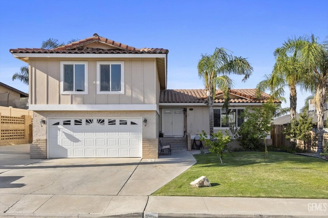 view of front of property featuring a garage and a front yard