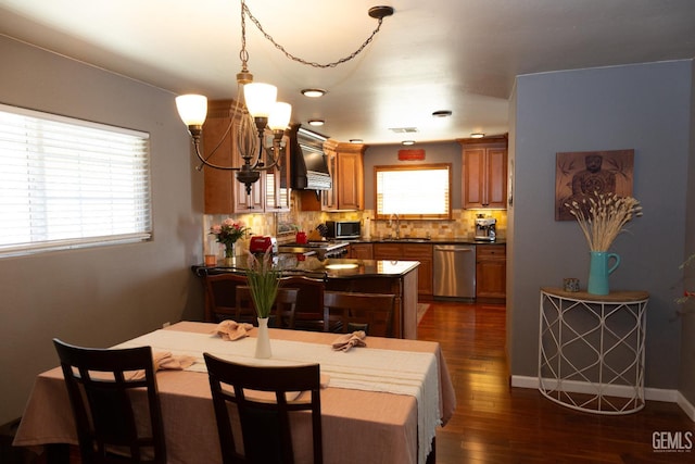 29201 Angus Ct, Tehachapi, CA 93561 - dining space with a chandelier and dark wood-type flooring