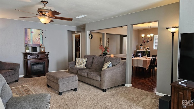 29201 Angus Ct, Tehachapi, CA 93561 - living area with carpet flooring, a chandelier, and a ceiling fan