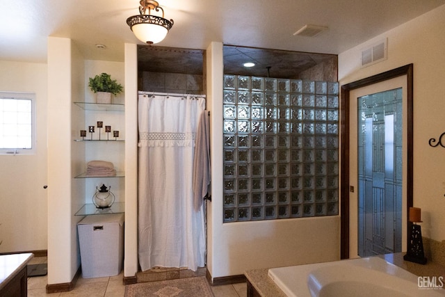 29201 Angus Ct, Tehachapi, CA 93561 - full bath with vanity, a shower with shower curtain, tile patterned floors, and a bath