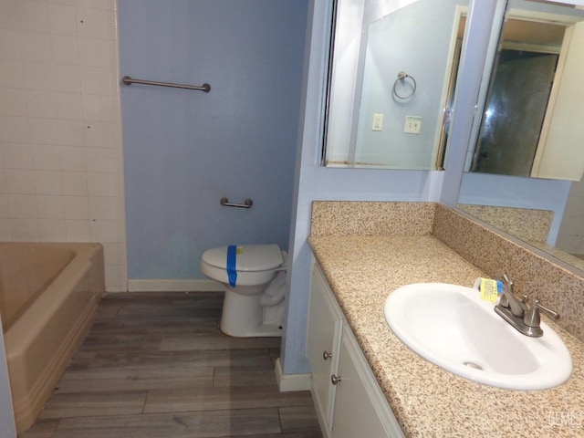 3001 Peach Tree Ct, Bakersfield, CA 93301 - full bath with baseboards, wood finished floors, vanity, and toilet