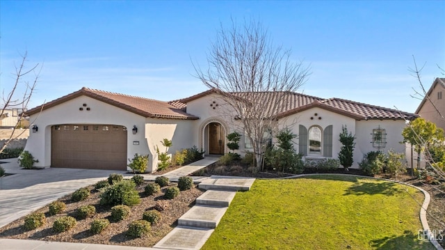 mediterranean / spanish house with a garage and a front lawn