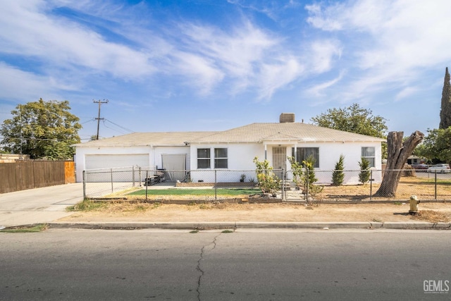 ranch-style home featuring a garage