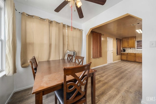 dining area featuring ceiling fan and hardwood / wood-style floors