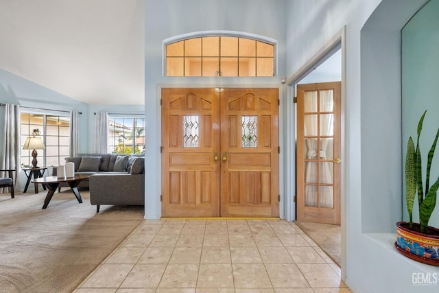 view of carpeted foyer