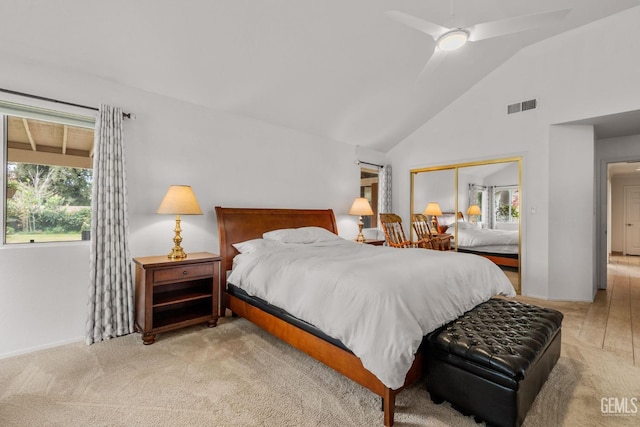 carpeted bedroom featuring vaulted ceiling, a closet, and ceiling fan