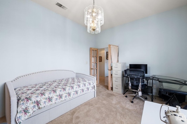 carpeted bedroom with a notable chandelier