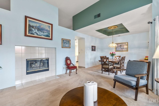 interior space with light colored carpet and a fireplace