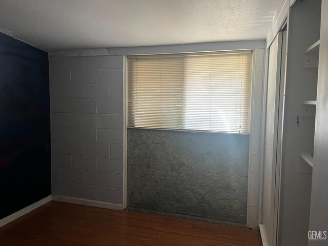 1473 22nd Ave, Delano, CA 93215 - unfurnished room with baseboards and wood finished floors