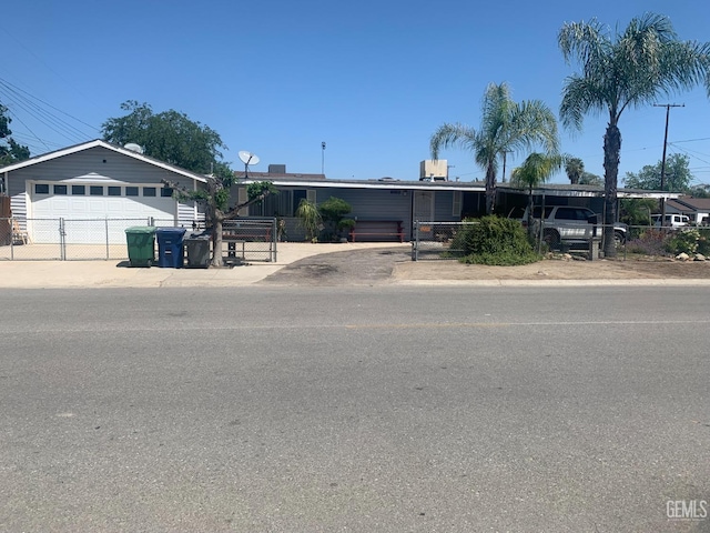 1473 22nd Ave, Delano, CA 93215 - view of front of home featuring fence and a detached garage