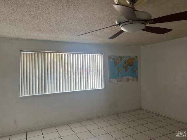 1473 22nd Ave, Delano, CA 93215 - empty room featuring a textured ceiling and ceiling fan