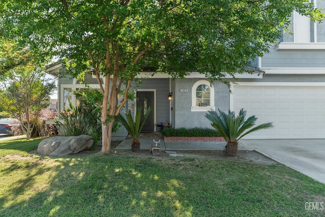 3809 Wensley Ct, Bakersfield, CA 93311 - view of property hidden behind natural elements featuring a garage, a front yard, concrete driveway, and stucco siding