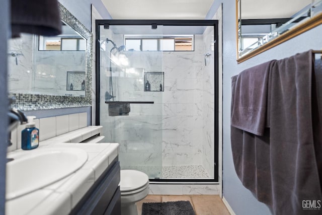3809 Wensley Ct, Bakersfield, CA 93311 - full bath with a marble finish shower, toilet, healthy amount of natural light, and vanity