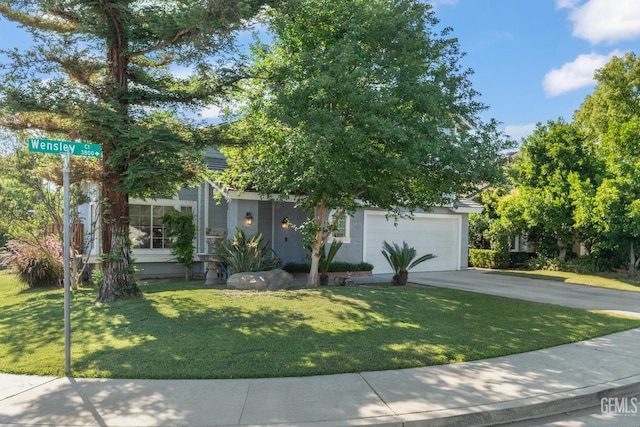 3809 Wensley Ct, Bakersfield, CA 93311 - view of property hidden behind natural elements with concrete driveway, an attached garage, and a front lawn