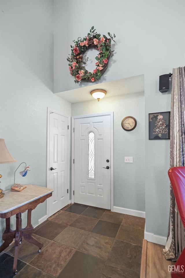 3809 Wensley Ct, Bakersfield, CA 93311 - entryway featuring baseboards and dark stone finish floors