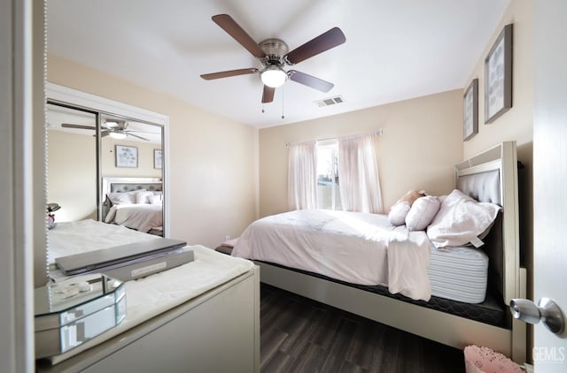 bedroom with dark wood-type flooring and ceiling fan