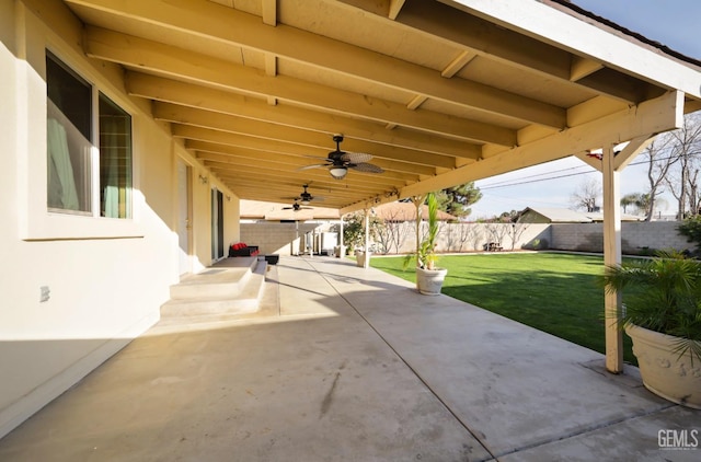 view of patio featuring ceiling fan