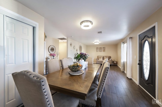 dining area featuring dark hardwood / wood-style flooring