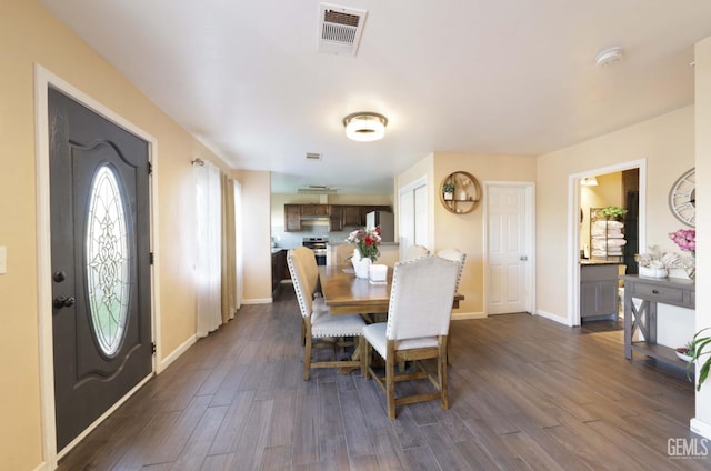 dining area featuring dark hardwood / wood-style flooring