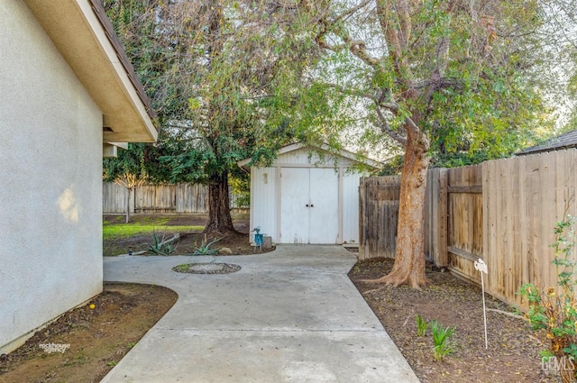 view of patio / terrace featuring a storage shed