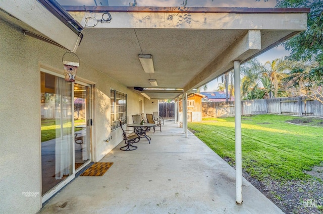 view of patio / terrace featuring a storage shed