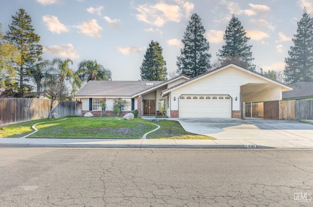 ranch-style home featuring a garage and a front lawn