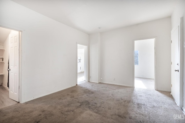 unfurnished room with light carpet