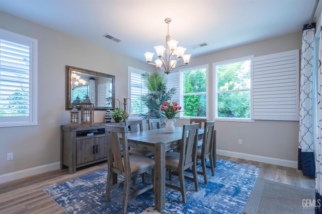 13620 Stonethwaite Ln, Bakersfield, CA 93311 - dining room with a chandelier, plenty of natural light, and wood finished floors