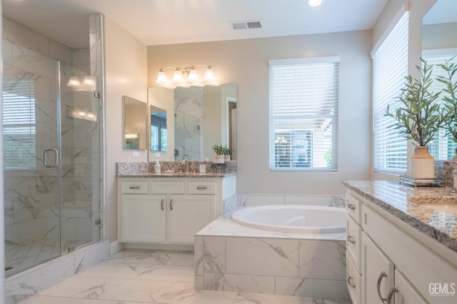 13620 Stonethwaite Ln, Bakersfield, CA 93311 - full bathroom featuring a marble finish shower, two vanities, a garden tub, marble finish floors, and recessed lighting