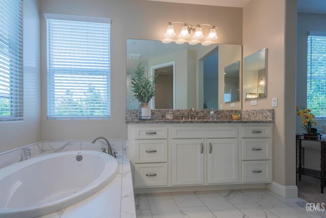 13620 Stonethwaite Ln, Bakersfield, CA 93311 - full bathroom featuring vanity, a garden tub, and marble finish flooring
