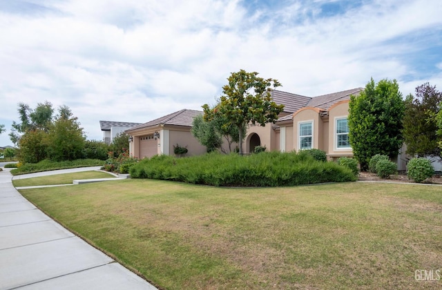 13620 Stonethwaite Ln, Bakersfield, CA 93311 - view of front of house with a garage, a front lawn, stucco siding, and a tiled roof