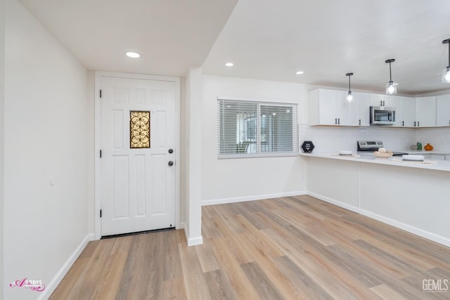 foyer with light hardwood / wood-style flooring