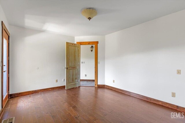 28221 Cumberland Rd, Tehachapi, CA 93561 - spare room with dark wood-style floors and baseboards