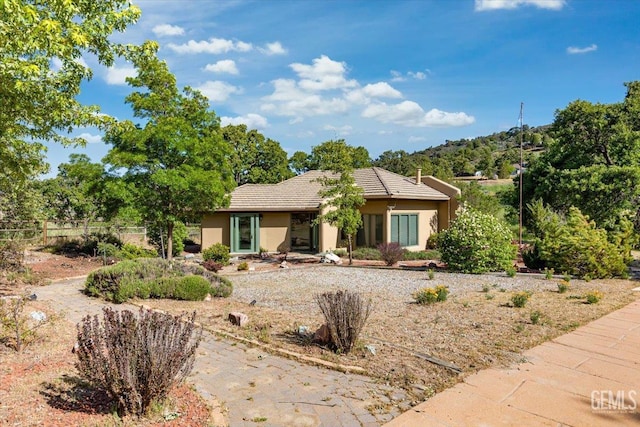 28221 Cumberland Rd, Tehachapi, CA 93561 - view of front facade with stucco siding and a tiled roof