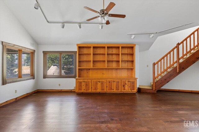 28221 Cumberland Rd, Tehachapi, CA 93561 - unfurnished living room featuring rail lighting, lofted ceiling, a ceiling fan, dark wood-style flooring, and stairway