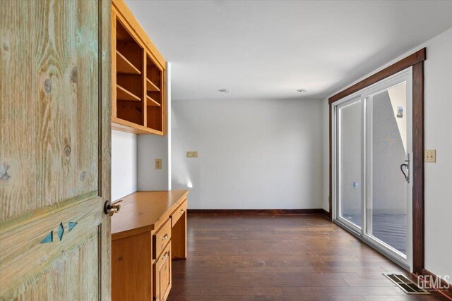 28221 Cumberland Rd, Tehachapi, CA 93561 - hallway with dark wood-style flooring and baseboards