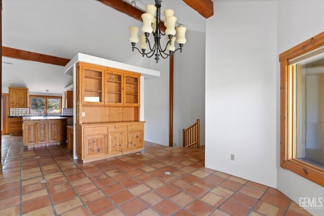 28221 Cumberland Rd, Tehachapi, CA 93561 - unfurnished dining area with beam ceiling and a chandelier