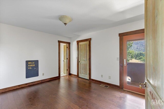 28221 Cumberland Rd, Tehachapi, CA 93561 - empty room with baseboards and dark wood finished floors