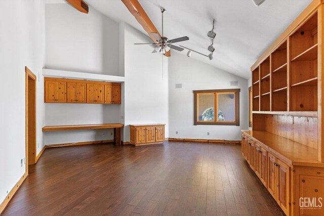 28221 Cumberland Rd, Tehachapi, CA 93561 - unfurnished living room with high vaulted ceiling, ceiling fan, dark wood-style flooring, track lighting, and baseboards