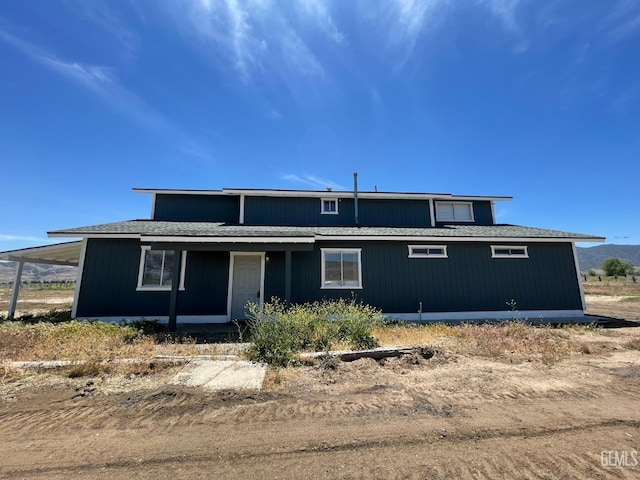 view of front of home with a carport