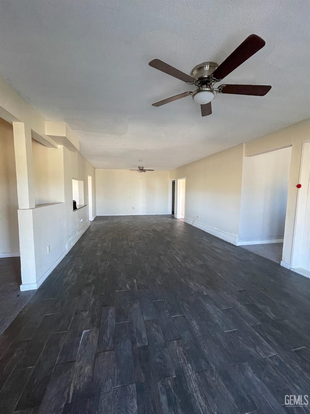 spare room with ceiling fan and dark hardwood / wood-style flooring